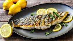 Grilled Sea Bass with Lemon and Herb Marinade (Bar grillé avec marinade au citron et aux herbes)