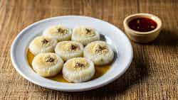 Rice Dumplings In Coconut Syrup (chhena Kheeri Puli)