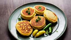 Rice Pancakes With Spicy Mashed Vegetables And Potatoes (dhuska Chokha Aloo Dum)