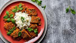 Somali Bariis iyo Digaag iyo Suugo iyo Xalwo iyo Kashaato (Rice with Chicken, Tomato Sauce, Halva, and Sesame Cookies)