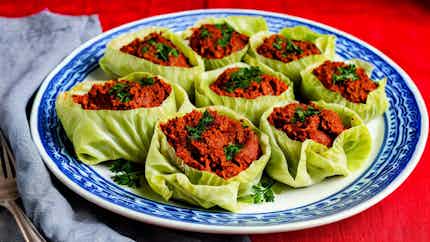 Lachanodolmades Me Rizi Kai Fytika (stuffed Cabbage Rolls With Rice And Herbs)