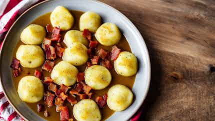 Potato Dumplings with Bacon and Sauerkraut (Kartupeļu Cepetis ar Speķi un Skābētiem kāpostiem)