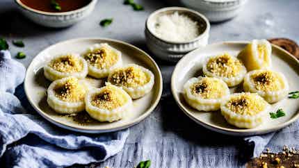 Rice Dumplings In Coconut Syrup (pitha Puli)